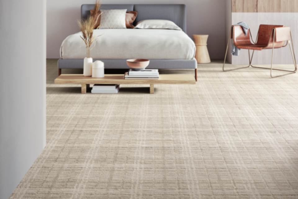 Beige natural patterned carpet in bedroom.